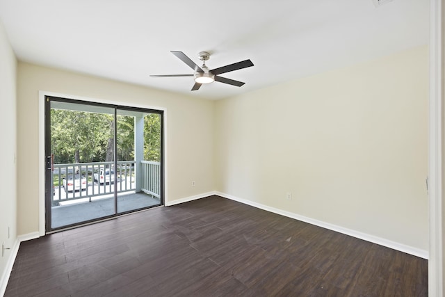 empty room with ceiling fan, baseboards, and dark wood finished floors