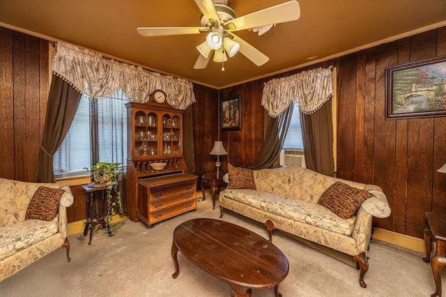 200 Fishburne St, Charleston, SC 29403 - carpeted living area featuring wood walls, ceiling fan, baseboards, and ornamental molding