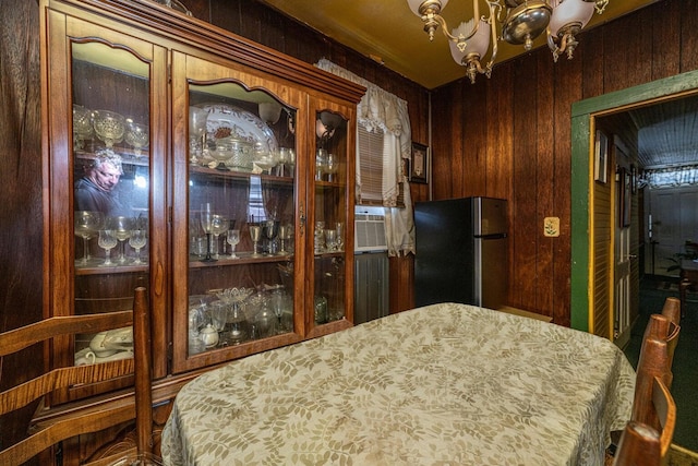 200 Fishburne St, Charleston, SC 29403 - dining area with wood walls and a chandelier