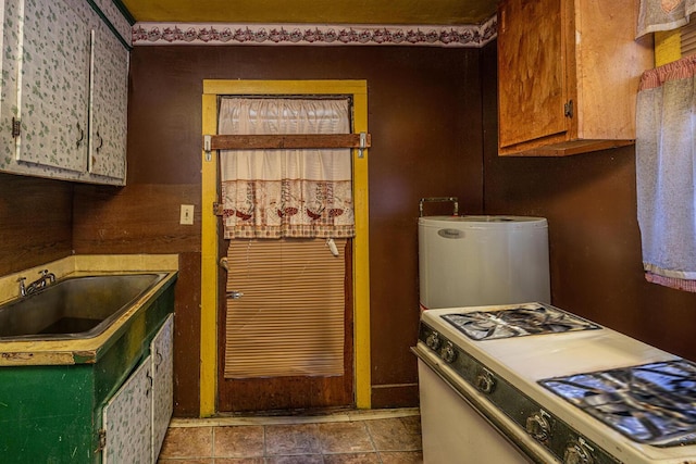200 Fishburne St, Charleston, SC 29403 - kitchen with a sink, water heater, and gas range gas stove