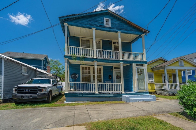 200 Fishburne St, Charleston, SC 29403 - view of front of house with covered porch and a balcony