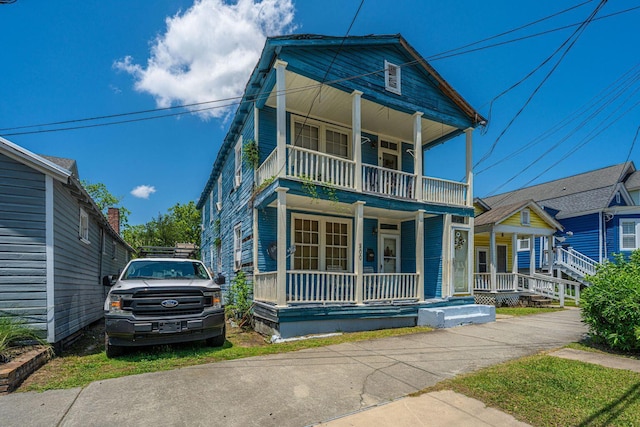 200 Fishburne St, Charleston, SC 29403 - view of front of home featuring covered porch and a balcony