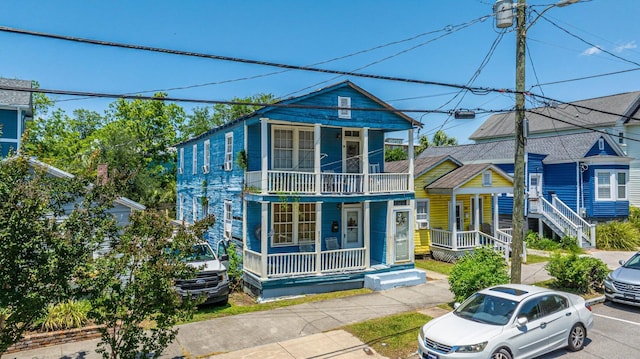 200 Fishburne St, Charleston, SC 29403 - view of property with a porch and a balcony