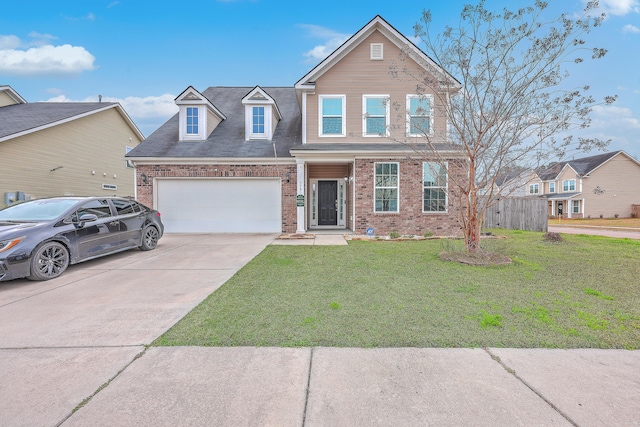 view of property featuring a front lawn and a garage