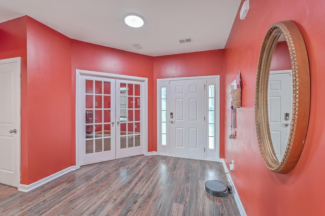 entrance foyer with french doors and dark hardwood / wood-style flooring