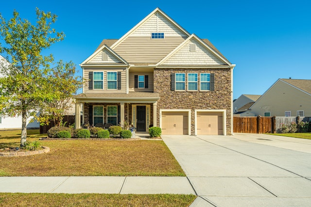 view of front of property featuring a front yard and a garage