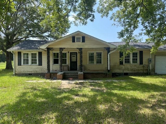 single story home featuring a garage, crawl space, and a front lawn