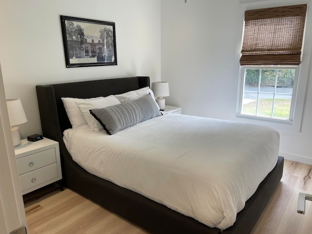 bedroom with light wood-type flooring