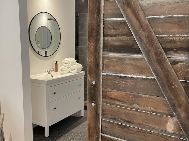 interior space with dark tile floors and vanity