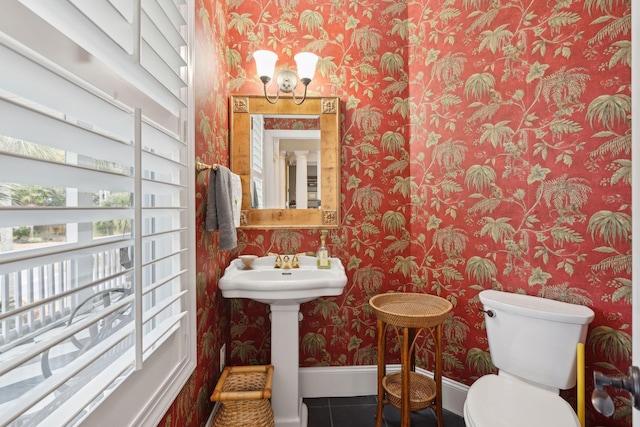 bathroom featuring tile patterned flooring and toilet