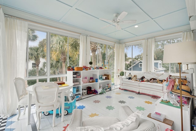 sunroom / solarium with coffered ceiling and ceiling fan