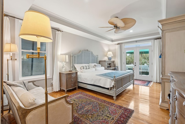 bedroom featuring french doors, crown molding, access to outside, ceiling fan, and light hardwood / wood-style floors