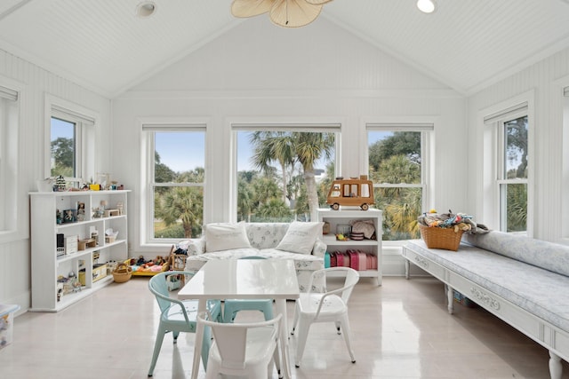 sunroom / solarium featuring a healthy amount of sunlight and vaulted ceiling