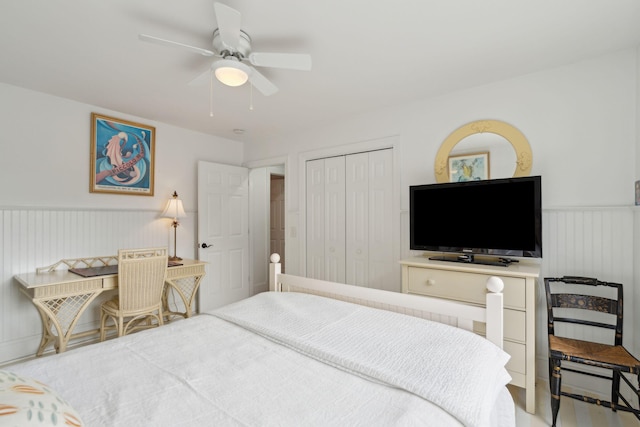 bedroom featuring ceiling fan and a closet