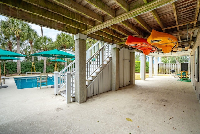 view of patio / terrace with a fenced in pool