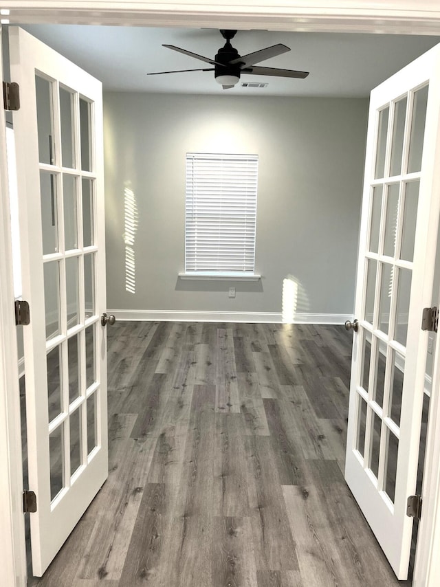 unfurnished room featuring french doors, ceiling fan, and hardwood / wood-style floors