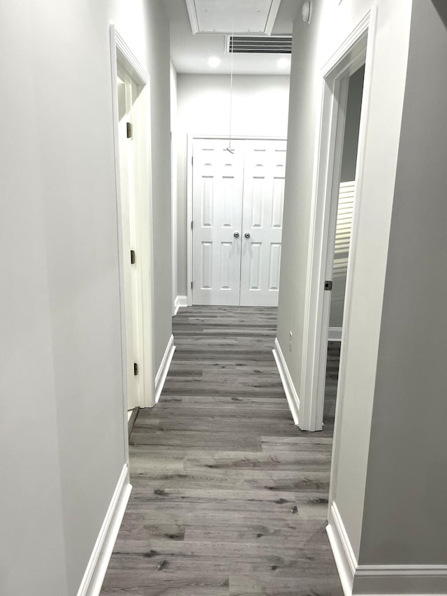 corridor featuring dark hardwood / wood-style flooring