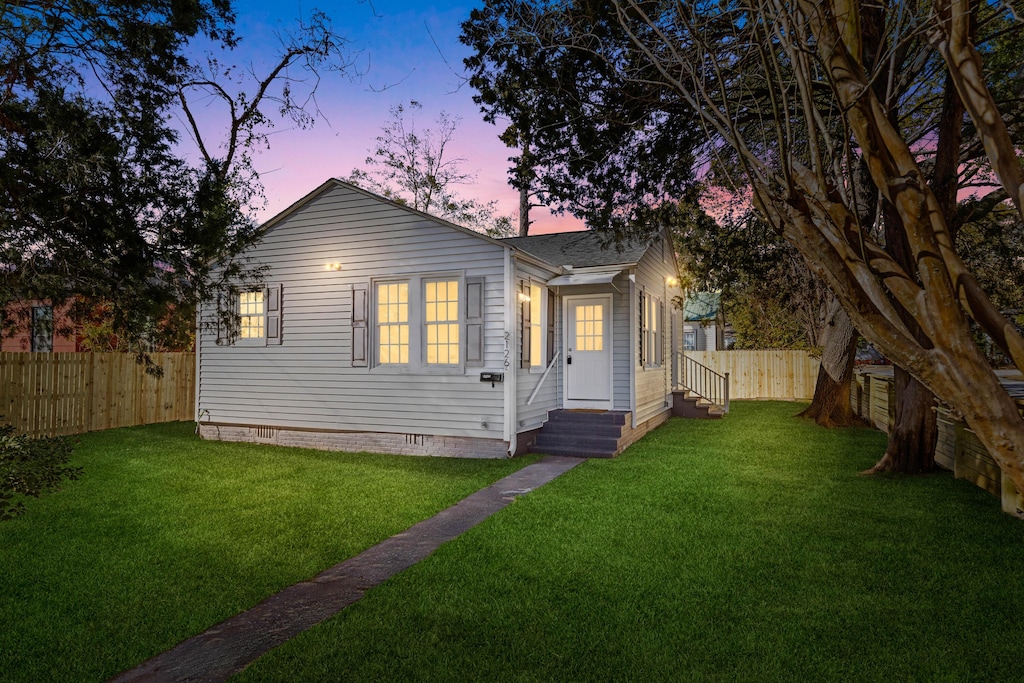 view of front of house with a lawn