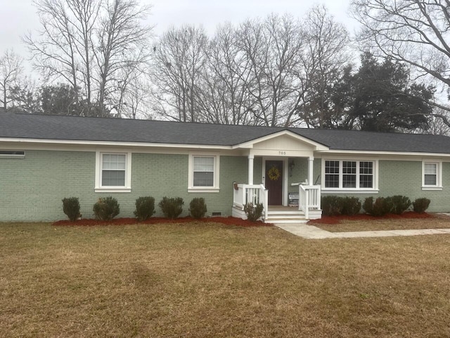 ranch-style home with a front lawn