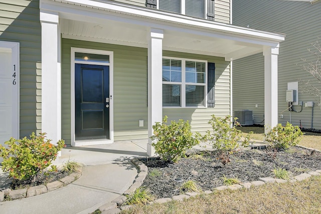 doorway to property featuring a porch and central air condition unit