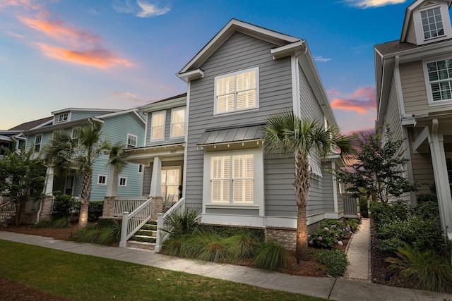 1557 Kepley Dr, Mount Pleasant, SC 29464 - view of front facade featuring a porch and a standing seam roof