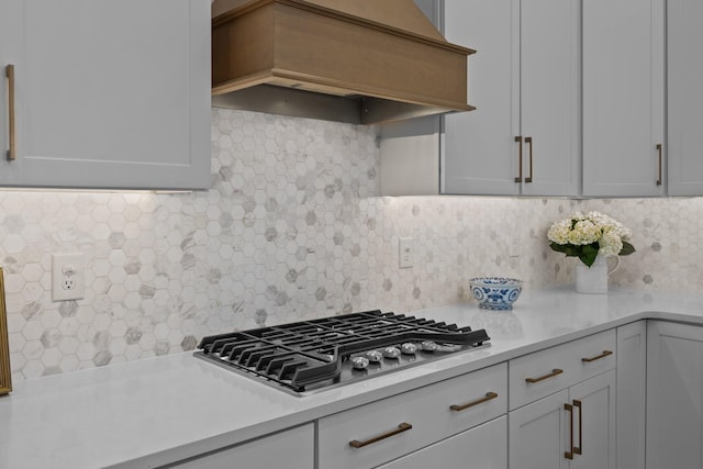 1557 Kepley Dr, Mount Pleasant, SC 29464 - kitchen with premium range hood, light countertops, stainless steel gas stovetop, and backsplash
