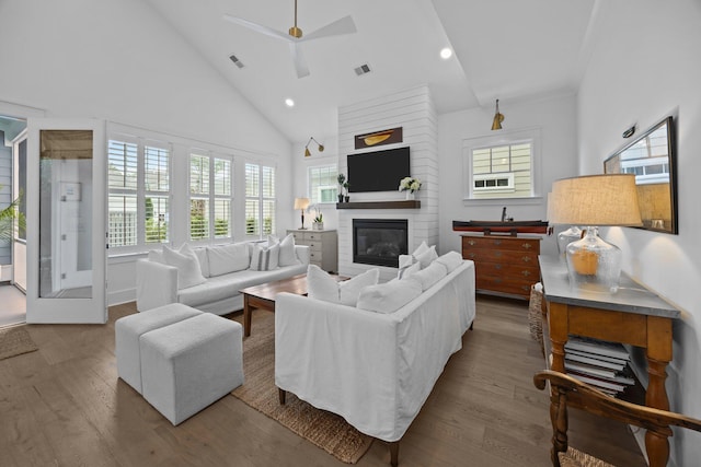 1557 Kepley Dr, Mount Pleasant, SC 29464 - living area with wood finished floors, a fireplace, high vaulted ceiling, a ceiling fan, and recessed lighting