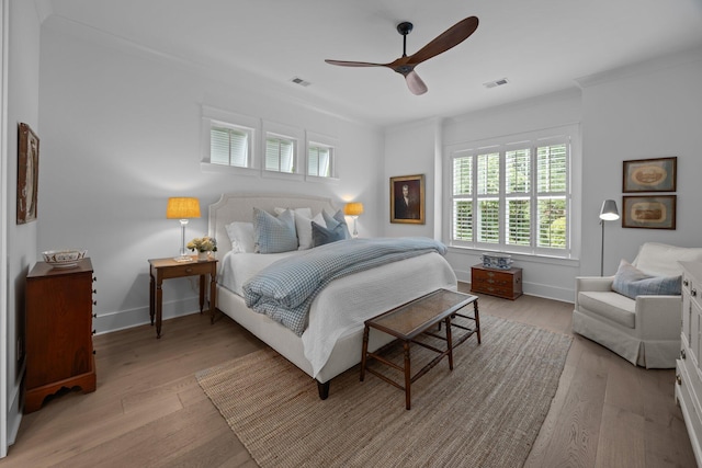 1557 Kepley Dr, Mount Pleasant, SC 29464 - bedroom featuring multiple windows, light wood-style floors, baseboards, crown molding, and a ceiling fan