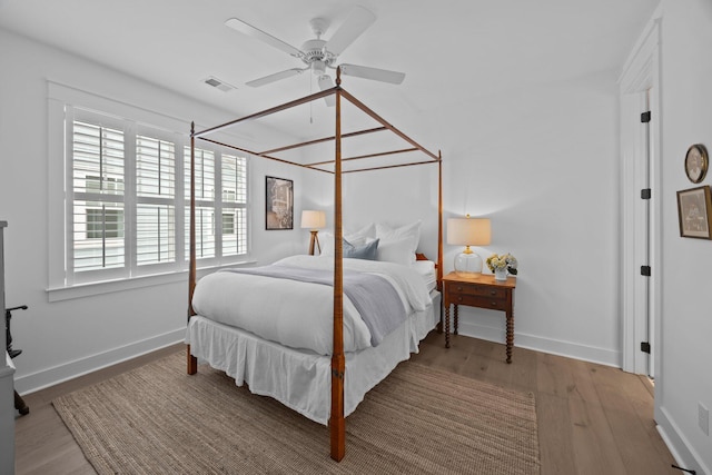 1557 Kepley Dr, Mount Pleasant, SC 29464 - bedroom with wood finished floors, baseboards, and a ceiling fan