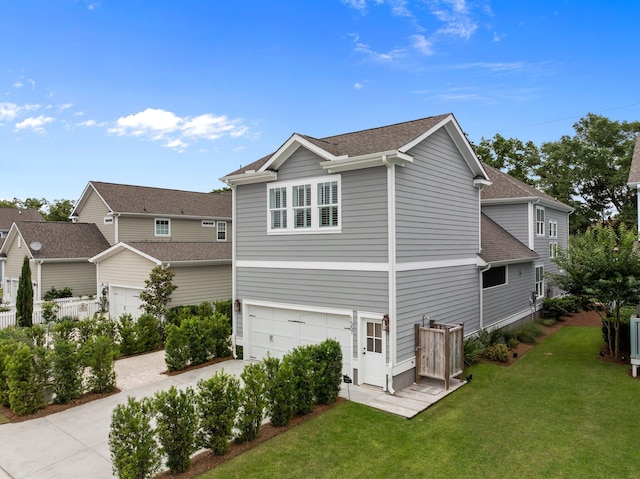 1557 Kepley Dr, Mount Pleasant, SC 29464 - view of side of home featuring a garage, driveway, a lawn, and roof with shingles