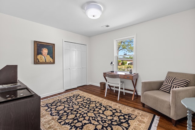 office featuring visible vents, baseboards, and dark wood-type flooring