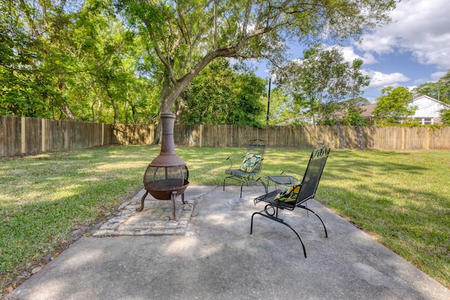 view of patio with a fire pit and a fenced backyard