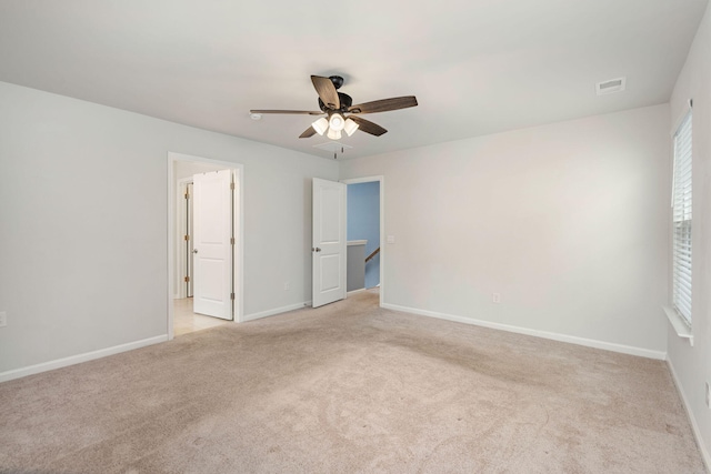 unfurnished bedroom featuring ceiling fan and light colored carpet