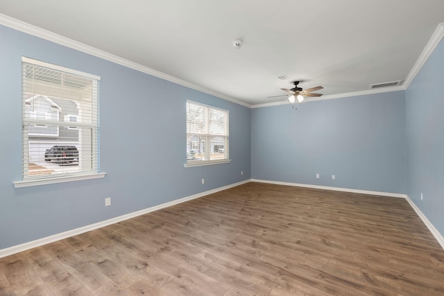 empty room featuring hardwood / wood-style floors, ceiling fan, and ornamental molding