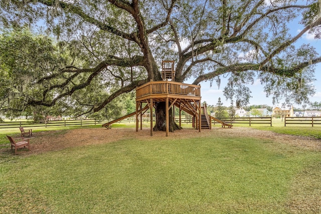 view of play area with a yard