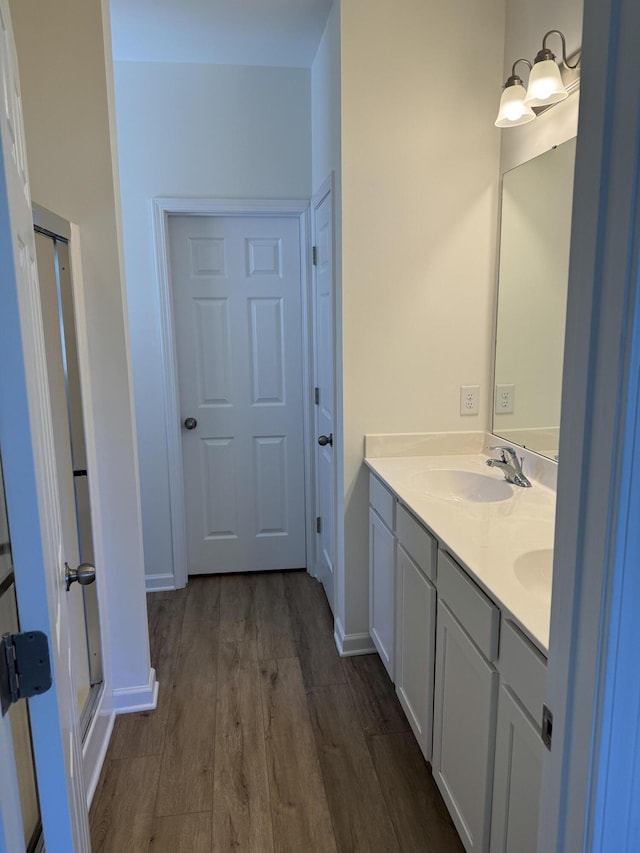 1208 N University Dr Unit A, Ladson, SC 29456 - full bathroom featuring baseboards, wood finished floors, a sink, and double vanity