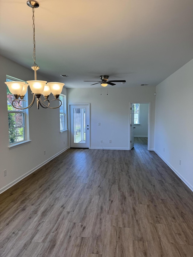 1208 N University Dr Unit A, Ladson, SC 29456 - unfurnished living room featuring ceiling fan with notable chandelier, baseboards, wood finished floors, and visible vents