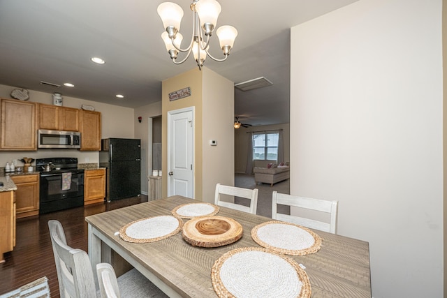 dining space featuring recessed lighting, a chandelier, and dark wood-style flooring