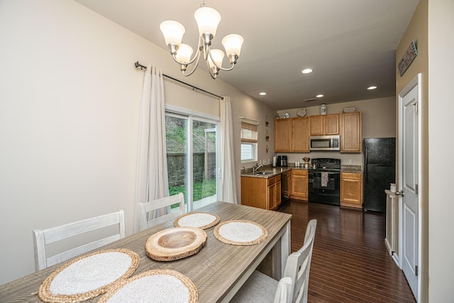 dining room with dark wood-style floors, a notable chandelier, and recessed lighting