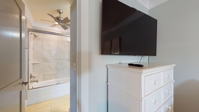 bathroom with tiled shower / bath, tile floors, ceiling fan, and crown molding