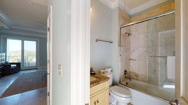 full bathroom with toilet, vanity, enclosed tub / shower combo, ornamental molding, and tile flooring