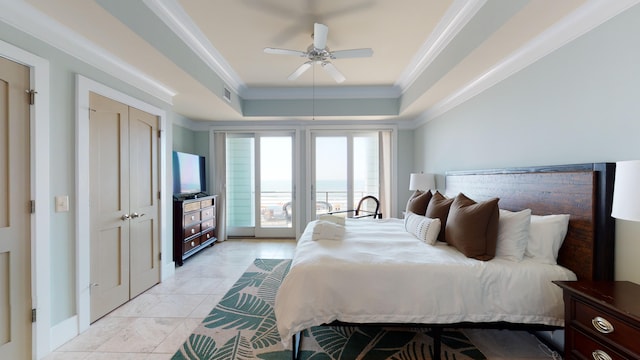 bedroom with light tile flooring, access to exterior, ceiling fan, crown molding, and a raised ceiling