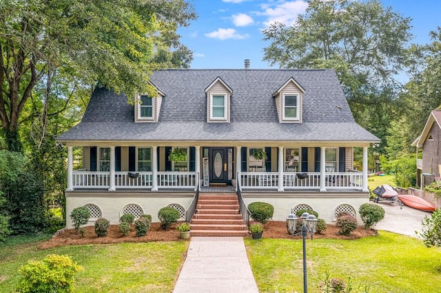 view of front facade with covered porch and a front lawn