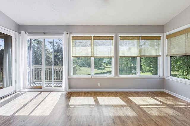 unfurnished sunroom featuring plenty of natural light