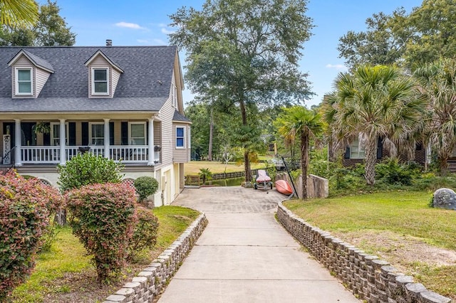 view of front facade with a garage and a front yard