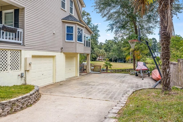 view of side of home with a garage