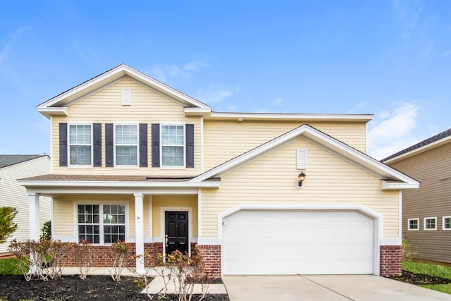 traditional-style house featuring brick siding, concrete driveway, and covered porch