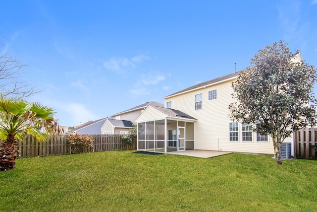 rear view of property with a sunroom and a patio