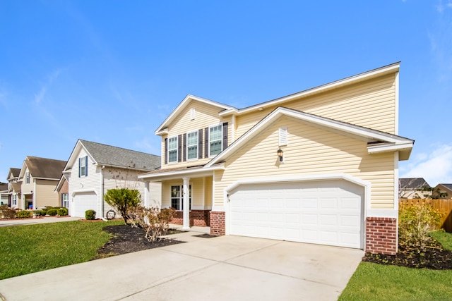 view of front of property featuring brick siding, driveway, and a garage