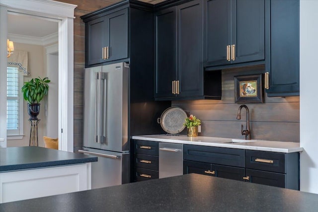kitchen featuring a notable chandelier, dark countertops, ornamental molding, and high end fridge